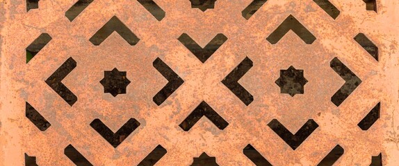 Wall Mural - Panorama of The steel manhole cover has a stencil to rust texture and background