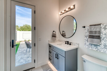 Wall Mural - bathroom with a glass door to a patio