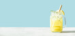 Banner. Lemonade on blue background close up, copy space