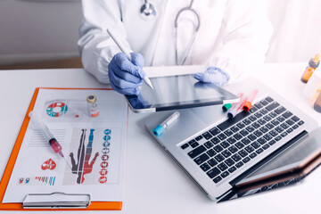 Virtual hospital, telemedicine, online medical, smart health, medical technology development concept. Doctor using digital tablet connecting with patient and health care icons on virtual screen