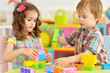 © aletia2011 - Portrait of bother and sister playing with cubes