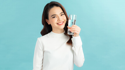 young asian woman with glass of water