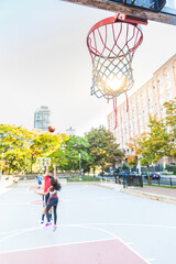 Wall Mural - Woman vs man playing basketball in Toronto