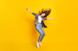 © deagreez - Full size photo of excited satisfied person closed eyes raise arms sides isolated on yellow color background
