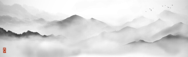 Misty mountains with gentle slopes and flock of birds in the sky. Traditional oriental ink painting sumi-e, u-sin, go-hua.