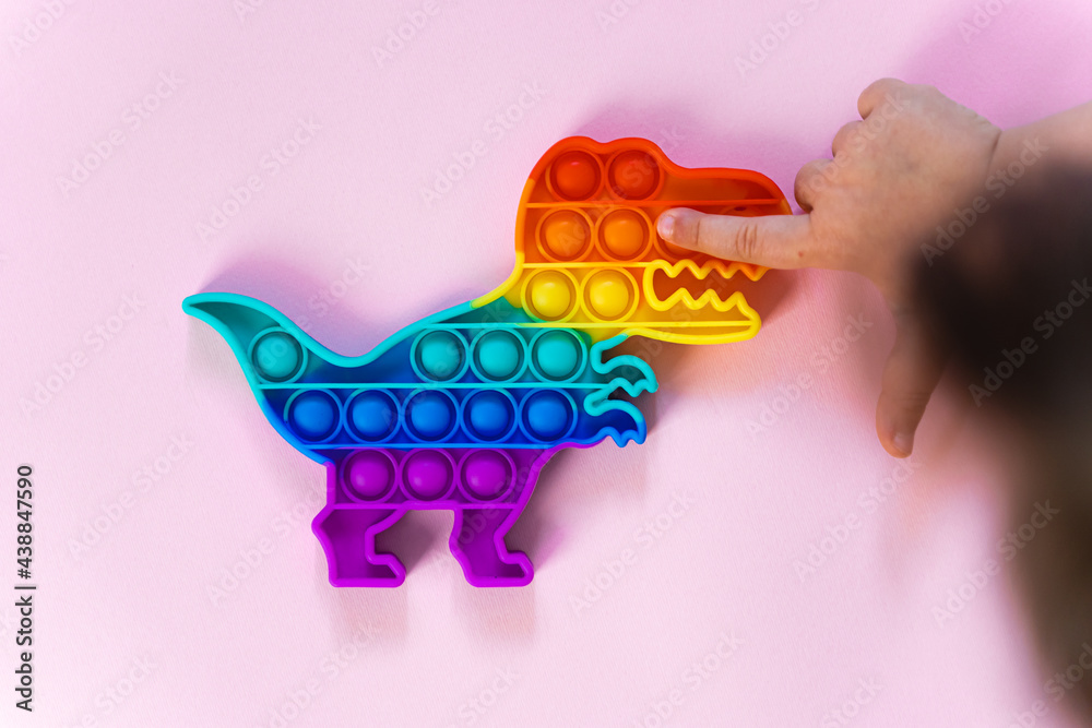 Popit Rainbow Toy In Rainbow Colours And Dino Shape Trendy Bubble Pop Fidget Funny Anti Stress Sensory Trend Pink Background And Finger Popping The Bubbles Wall Mural Troyanphoto Popit Rainbow Toy In Rainbow Colours And Dino Shape Trendy Bubble Pop Fidget Funny Anti Stress Sensory Trend Pink Background And Finger Popping The Bubbles Wall Mural Troyanphoto