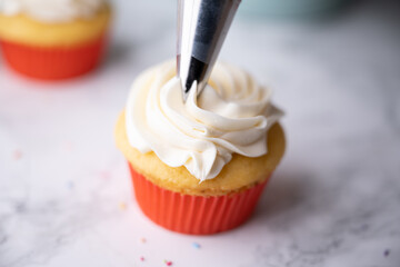 Canvas Print - pipping flosting on colorful cupcake