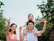 © eastfenceimage - Happy family of three in the outdoor group photo