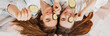 © Daria Lukoiko - Two girls make homemade face and hair beauty masks. Cucumbers for the freshness of the skin around the eyes. Women take care of youthful skin. Girlfriends laugh at home lying on the floor on pillows.