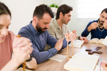 Young people praying to have more hope