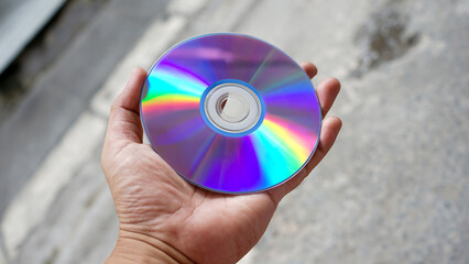 hand holding a cd