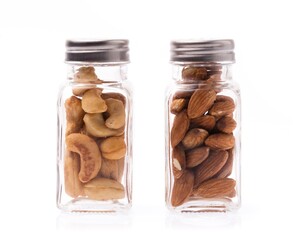 Canvas Print - bottle of Cashew nuts with Almonds isolated on white background