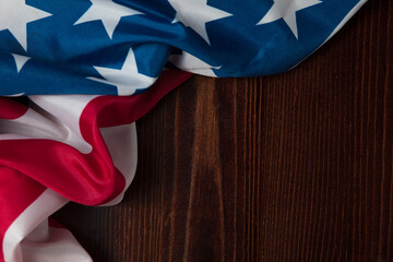 Closeup of American flag on wooden background