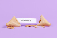 Fortune Cookie With Motivational Text Saying 'You Can Do It' On Purple Background
