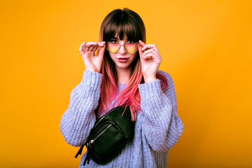 Wall Mural - Bright funny portrait of cheerful hipster woman with bright pink hair