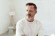 © contrastwerkstatt - Serious middle-aged man looking speculatively at the camera