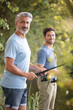 © auremar - portrait of cheerful two bearded men fishing