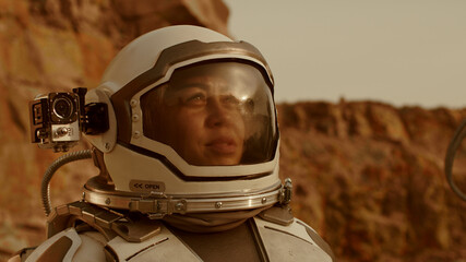 Wall Mural - Female cosmonaut recording video during expedition on Mars