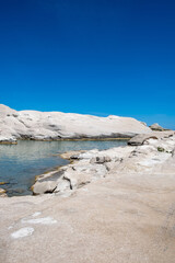 Wall Mural - Sarakiniko beach at Milos island, Cyclades Greece. White rock formations, turquoise water