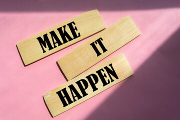 Wall Mural - Make It Happen written on a wooden blocks. Motivation coaching career and business concept.