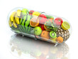 Vitamin pill capsule with fruits and vegetables. Nutrition supplemet and health eating concept.