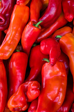 Background Grouping Of Red Peppers In A Farmer's Market Stand