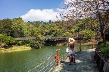 Wall Mural - woman walk near the water in the reservoir