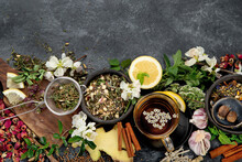 Various Kinds Of Herbal Tea On Dark Background. Natural Herbs Medicine.
