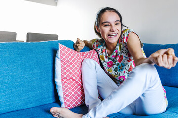 portrait of latin disabled girl with cerebral palsy smiling at Home in disability concept in Latin America