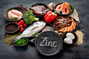 Wall Mural - Food high in zinc on dark background. Healthy eating concept.