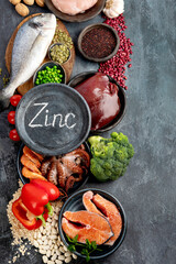 Wall Mural - Food high in zinc on dark background. Healthy eating concept.