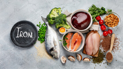 Wall Mural - Food high in iron on light gray background. Healthy eating concept.