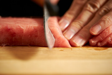 Poster - Cutting fresh tuna with a sashimi knife