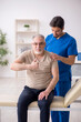 © Elnur - Old male patient visting young male doctor chiropractor
