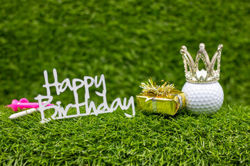 Wall Mural - Golf ball with word happy birthday are on green grass with gifts