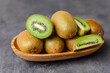 kiwi fruit on a wooden plate