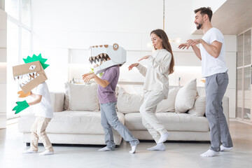 Wall Mural - Family playing dinosaurs at home