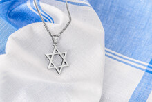 Star Of David ("Magen David") With Chain On White-blue Fabric.