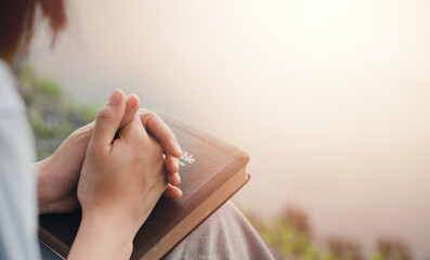 girl's hand sitting praying for god's blessing along with coming to heal a peaceful life with nature