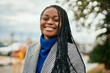 © Krakenimages.com - Young african american businesswoman smiling happy standing at the city.