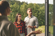 © Epic_pic - Young family couple meeting with realtor and looking house