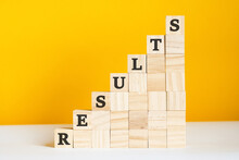 the word results is written on a wooden cubes, concept