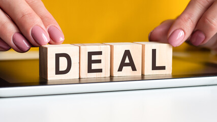 Sticker - word deal made with wood building blocks, stock image