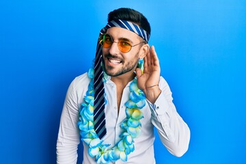 Canvas Print - Young hispanic businessman wearing party funny style with tie on head smiling with hand over ear listening an hearing to rumor or gossip. deafness concept.