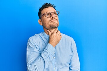 Sticker - Young hispanic man wearing casual clothes and glasses touching painful neck, sore throat for flu, clod and infection