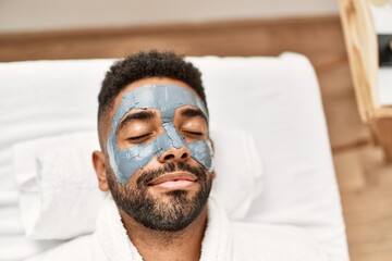 Sticker - Man relaxed with facial treatment at beauty center.