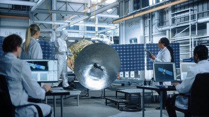 Wall Mural - Technicians in Protective Suits Working on Satellite Construction, under Chief Engineer Control. Aerospace Agency Manufacturing Facility: Scientists Assembling Spacecraft. Space Exploration Mission