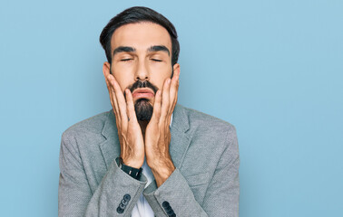 Wall Mural - Young hispanic man wearing business clothes tired hands covering face, depression and sadness, upset and irritated for problem