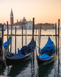 Gondolas parked along the grand canal at sunset