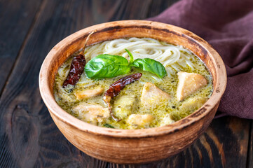 Wall Mural - Bowl of green curry with noodles